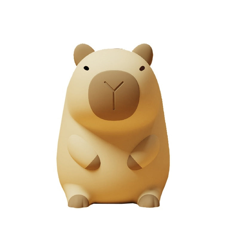 Lámpara nocturna Oluna con forma de capibara, silicona suave, fondo blanco